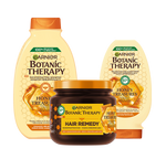 Trzy produkty Garnier Botanic Therapy Honey Treasures (szampon, odżywka, maska), na białym tle
