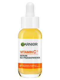 Serum Garnier z witaminą C+ w szklanej buteleczce z żółtym płynem i pipetą, na jasnym tle