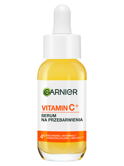 Serum Garnier z witaminą C+ w szklanej buteleczce z żółtym płynem i pipetą, na jasnym tle