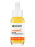 Serum Garnier z witaminą C+ w szklanej buteleczce z żółtym płynem i pipetą, na jasnym tle