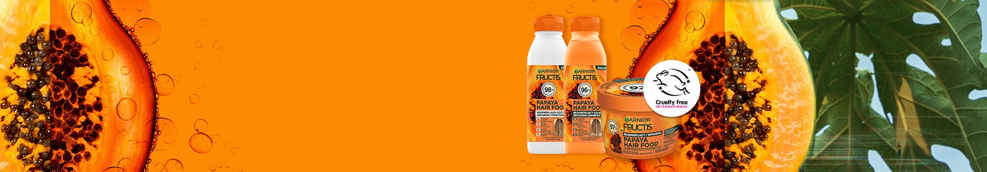 Szampon, odżywka i maska Garnier Fructis Papaya Hair Food, na pomarańczowym tle z połówkami papai