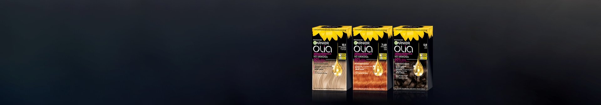 Trzy opakowania farby Garnier Olia w rzędzie, na ciemnej, lśniącej powierzchni