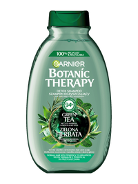 Zielona butelka szamponu Garnier Botanic Therapy z motywem zielonej herbaty, na białym tle