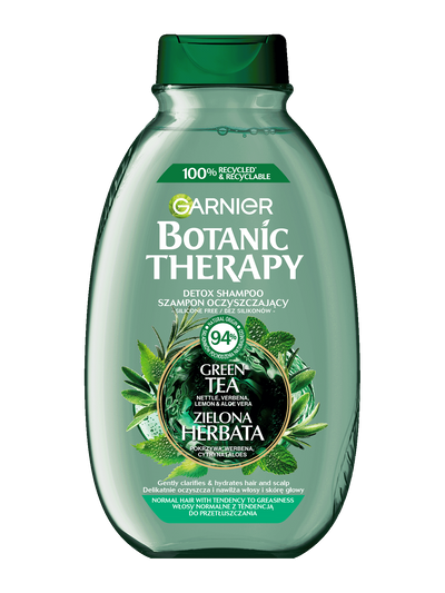 Zielona butelka szamponu Garnier Botanic Therapy z motywem zielonej herbaty, na białym tle