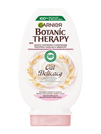 Biała butelka odżywki Garnier Botanic Therapy Oat Delicacy z motywem owsa i różowym kapslem