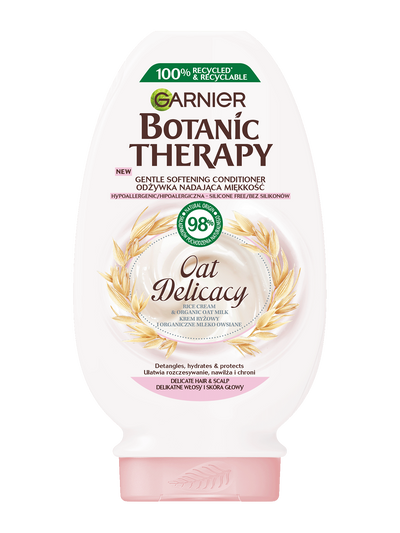 Biała butelka odżywki Garnier Botanic Therapy Oat Delicacy z motywem owsa i różowym kapslem