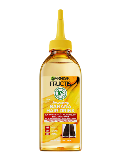 Butelka Garnier Fructis z bursztynowym płynem i żółtym dziubkiem, napis „97% naturalnych składników”