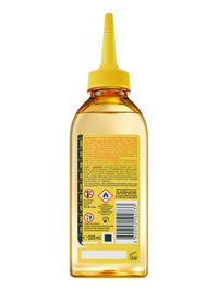 Przezroczysta butelka Garnier Fructis ze złocistym płynem i żółtym dziubkiem, tylna etykieta