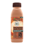 Jasnobrązowa butelka szamponu Garnier Fructis Macadamia Hair Food z motywem orzecha, na białym tle