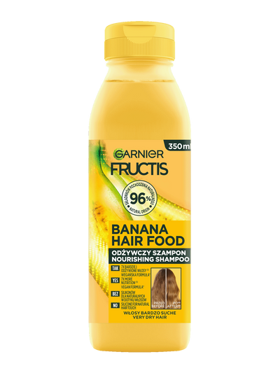 Żółta butelka szamponu Garnier Fructis Banana Hair Food, na czarnym tle