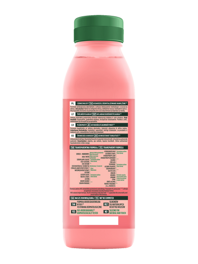 Przezroczysta butelka z różowym płynem i zielonym kapslem, szczegółowa etykieta produktu