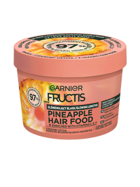 Brzoskwiniowo-różowy słoik Garnier Fructis Pineapple Hair Food z motywem ananasa, pod skosem