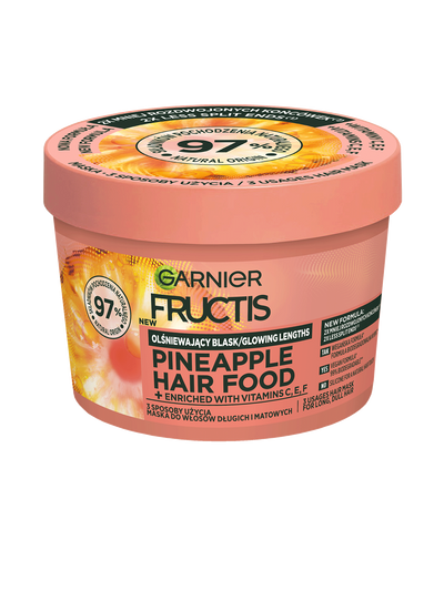Brzoskwiniowo-różowy słoik Garnier Fructis Pineapple Hair Food z motywem ananasa, pod skosem