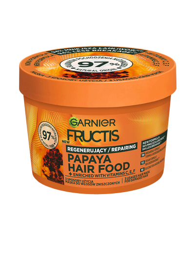 Pomarańczowy słoik maski regenerującej Garnier Fructis Papaya Hair Food, na czarnym tle