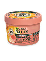 Okrągły, łososiowo-różowy słoik Garnier Fructis Pineapple Hair Food z żółtym ananasem
