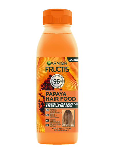 Pomarańczowa butelka szamponu Garnier Fructis Papaya Hair Food, na jasnym tle