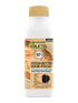 Biała butelka odżywki Garnier Fructis Cocoa Butter Hair Food z beżową etykietą
