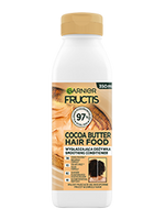 Biała butelka odżywki Garnier Fructis Cocoa Butter Hair Food z beżową etykietą