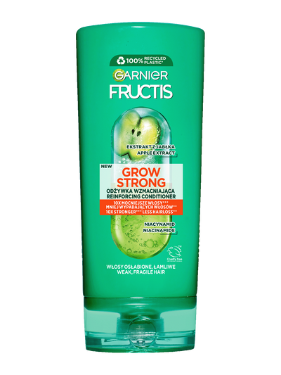 Zielona butelka odżywki Garnier Fructis z etykietą, na ciemnozielonym tle, „100% recyklingu”