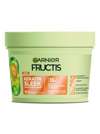 Jasnozielony słoik maski Garnier Fructis Keratin Sleek z pomarańczową etykietą, ciemnozielona pokrywka