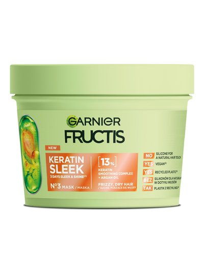 Jasnozielony słoik maski Garnier Fructis Keratin Sleek z pomarańczową etykietą, ciemnozielona pokrywka