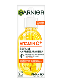 Buteleczka serum Garnier Vitamin C+ z pipetą, żółtym płynem, plasterkami cytrusów i pęcherzykami, na białym tle