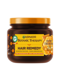 Brązowy słoik maski Garnier Botanic Therapy Honey Treasures z pomarańczową pokrywką i motywem plastra miodu