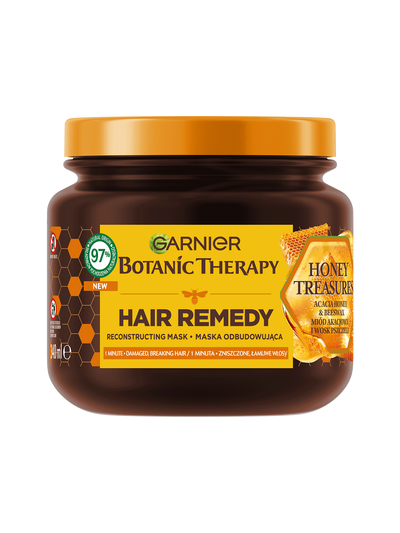 Brązowy słoik maski Garnier Botanic Therapy Honey Treasures z pomarańczową pokrywką i motywem plastra miodu