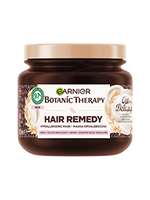 Ciemnobrązowy słoik maski Garnier Botanic Therapy Oat Delicacy ze złotą pokrywką, motyw owsa