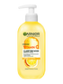 Żółta butelka Garnier Vitamin C Clarifying Wash z białą pompką i motywem cytrusów