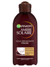 Brązowa butelka olejku przyspieszającego opalanie Garnier Ambre Solaire z motywem kokosa