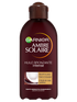 Brązowa butelka olejku przyspieszającego opalanie Garnier Ambre Solaire z motywem kokosa