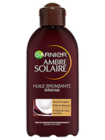 Brązowa butelka olejku przyspieszającego opalanie Garnier Ambre Solaire z motywem kokosa
